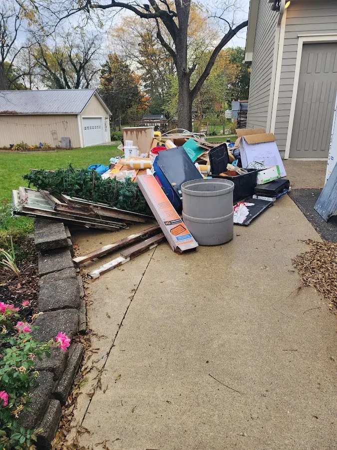 Dumpster being loaded with debris for Commercial Dumpster Rental in Sunnyslope